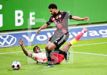 2021-04-03 - Serge Gnabry of Bayern Munich and Nordi Mukiele of RB Leipzig during the German championship Bundesliga football match between RB Leipzig and Bayern Munich on April 3, 2021 at Red Bull Arena in Leipzig, Germany - Photo Valeria Witters / Witters / firo sportphoto / DPPI - RB LEIPZIG VS BAYERN MUNICH - GERMAN BUNDESLIGA - SOCCER