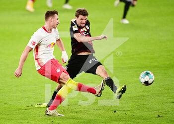 2021-04-03 - Willi Orban of RB Leipzig and Thomas Mueller of Bayern Munich during the German championship Bundesliga football match between RB Leipzig and Bayern Munich on April 3, 2021 at Red Bull Arena in Leipzig, Germany - Photo Valeria Witters / Witters / firo sportphoto / DPPI - RB LEIPZIG VS BAYERN MUNICH - GERMAN BUNDESLIGA - SOCCER