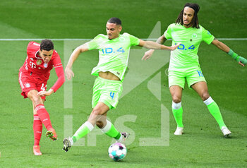 2021-04-17 - Jamal Musiala of Bayern Munich scores the 0-1 goal, Maxence Lacroix, Kevin Mbabu of Wolfsburg during the German championship Bundesliga football match between VfL Wolfsburg and Bayern Munich on April 17, 2021 at Volkswagen Arena in Wolfsburg, Germany - Photo Tim Groothuis / Witters / firosportphoto / DPPI - VFL WOLFSBURG VS BAYERN MUNICH - GERMAN BUNDESLIGA - SOCCER