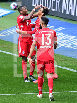 2021-04-17 - Jamal Musiala of Bayern Munich celebrates the 1-3 goal with David Alaba and Eric Maxim Choupo-Moting during the German championship Bundesliga football match between VfL Wolfsburg and Bayern Munich on April 17, 2021 at Volkswagen Arena in Wolfsburg, Germany - Photo Tim Groothuis / Witters / firosportphoto / DPPI - VFL WOLFSBURG VS BAYERN MUNICH - GERMAN BUNDESLIGA - SOCCER