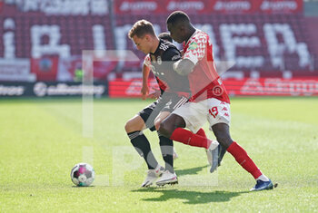 2021-04-24 - Joshua Kimmich of Bayern Munich and Moussa Niakhate of Mainz during the German championship Bundesliga football match between FSV Mainz 05 and Bayern Munich on April 24, 2021 at Opel Arena in Mainz, Germany - Photo Thorsten Wagner / Witters / firo sportphoto / DPPI - FSV MAINZ 05 VS BAYERN MUNICH - GERMAN BUNDESLIGA - SOCCER