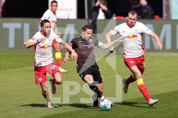 2021-04-25 - Gonzalo Castro of Stuttgart and Kevin Kampl, Lukas Klostermann of RB Leipzig during the German championship Bundesliga football match between Red Bull Leipzig and VfB Stuttgart on April 25, 2021 at Red Bull Arena in Leipzig, Germany - Photo Ralf Ibing / firo Sportphoto / DPPI - RED BULL LEIPZIG VS VFB STUTTGART - GERMAN BUNDESLIGA - SOCCER