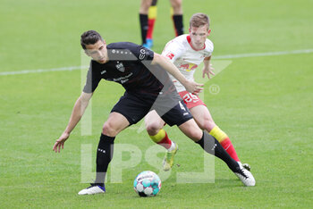 2021-04-25 - Marc-Oliver Kempf of Stuttgart and Dani Olmo of RB Leipzig during the German championship Bundesliga football match between Red Bull Leipzig and VfB Stuttgart on April 25, 2021 at Red Bull Arena in Leipzig, Germany - Photo Ralf Ibing / firo Sportphoto / DPPI - RED BULL LEIPZIG VS VFB STUTTGART - GERMAN BUNDESLIGA - SOCCER