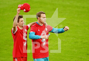 2021-05-08 - Thomas Mueller and Manuel Neuer of Bayern Munich celebrate the championship title after the German championship Bundesliga football match between Bayern Munich and Borussia Moenchengladbach on May 8, 2021 at Allianz Arena in Munich, Germany - Photo Lennart Preiss / Witters / firo sportphoto / DPPI - BAYERN MUNICH VS BORUSSIA MOENCHENGLADBACH - GERMAN BUNDESLIGA - SOCCER