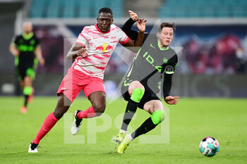 2021-05-16 - Ibrahima Konate of Leipzig and Wout Weghorst of Wolfsburg during the German championship Bundesliga football match between RB Leipzig and VfL Wolfsburg on May 16, 2021 at Red Bull Arena in Leipzig, Germany - Photo Valeria Witters / Witters / firo Sportphoto / DPPI - RB LEIPZIG VS VFL WOLFSBURG - GERMAN BUNDESLIGA - SOCCER