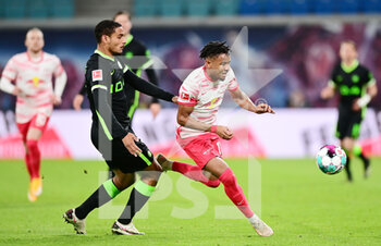2021-05-16 - Christopher Nkunku of Leipzig and Maxence Lacroix of Wolfsburg during the German championship Bundesliga football match between RB Leipzig and VfL Wolfsburg on May 16, 2021 at Red Bull Arena in Leipzig, Germany - Photo Valeria Witters / Witters / firo Sportphoto / DPPI - RB LEIPZIG VS VFL WOLFSBURG - GERMAN BUNDESLIGA - SOCCER