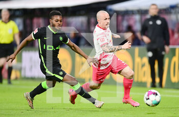 2021-05-16 - Angelino of Leipzig and Ridle Baku of Wolfsburg during the German championship Bundesliga football match between RB Leipzig and VfL Wolfsburg on May 16, 2021 at Red Bull Arena in Leipzig, Germany - Photo Valeria Witters / Witters / firo Sportphoto / DPPI - RB LEIPZIG VS VFL WOLFSBURG - GERMAN BUNDESLIGA - SOCCER