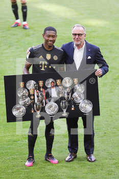 2021-05-22 - David Alaba poses for a photo with CEO Karl-Heinz Rummenigge at the farewell ceremony during the German championship Bundesliga football match between Bayern Munich and Augsburg on May 22, 2021 at Allianz Arena in Munich, Germany - Photo Stefan Matzke / Sampics / firo Sportphoto / DPPI - BAYERN MUNICH VS AUGSBURG - GERMAN BUNDESLIGA - SOCCER