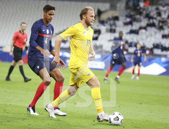 2020-10-07 - Roman Bezus of Ukraine, Raphael Varane of France (left) during the Friendly Game football match between France and Ukraine on October 7, 2020 at Stade de France in Saint-Denis, France - Photo Jean Catuffe / DPPI - FRIENDLY GAME FOOTBALL MATCH BETWEEN FRANCE AND UKRAINE - FRIENDLY MATCH - SOCCER