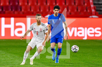 2021-03-25 - Sergio Canales of Spain and Andreas Bouchalakis of Greece during the 2022 FIFA World Cup, Qualifiers, Group B football match between Spain and Greece on March 25, 2021 at Estadio Municipal Nuevo Los Carmenes in Granada, Spain - Photo Pablo Morano / Orange Pictures / DPPI - 2022 FIFA WORLD CUP, QUALIFIERS, GROUP B - SPAIN AND GREECE - FIFA WORLD CUP - SOCCER