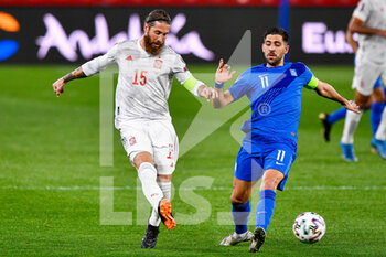 2021-03-25 - Sergio Ramos of Spain and Tasos Bakasetas of Greece during the 2022 FIFA World Cup, Qualifiers, Group B football match between Spain and Greece on March 25, 2021 at Estadio Municipal Nuevo Los Carmenes in Granada, Spain - Photo Pablo Morano / Orange Pictures / DPPI - 2022 FIFA WORLD CUP, QUALIFIERS, GROUP B - SPAIN AND GREECE - FIFA WORLD CUP - SOCCER