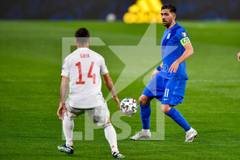 2021-03-25 - Jose Gaya of Spain and Tasos Bakasetas of Greece during the 2022 FIFA World Cup, Qualifiers, Group B football match between Spain and Greece on March 25, 2021 at Estadio Municipal Nuevo Los Carmenes in Granada, Spain - Photo Pablo Morano / Orange Pictures / DPPI - 2022 FIFA WORLD CUP, QUALIFIERS, GROUP B - SPAIN AND GREECE - FIFA WORLD CUP - SOCCER