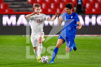 2021-03-25 - Dani Olmo of Spain and Andreas Bouchalakis of Greece during the 2022 FIFA World Cup, Qualifiers, Group B football match between Spain and Greece on March 25, 2021 at Estadio Municipal Nuevo Los Carmenes in Granada, Spain - Photo Pablo Morano / Orange Pictures / DPPI - 2022 FIFA WORLD CUP, QUALIFIERS, GROUP B - SPAIN AND GREECE - FIFA WORLD CUP - SOCCER