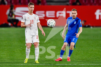 2021-03-25 - Dani Olmo of Spain and Michalis Bakakis of Greece during the 2022 FIFA World Cup, Qualifiers, Group B football match between Spain and Greece on March 25, 2021 at Estadio Municipal Nuevo Los Carmenes in Granada, Spain - Photo Pablo Morano / Orange Pictures / DPPI - 2022 FIFA WORLD CUP, QUALIFIERS, GROUP B - SPAIN AND GREECE - FIFA WORLD CUP - SOCCER