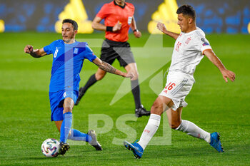 2021-03-25 - Carlos Zeca of Greece and Rodri of Spain during the 2022 FIFA World Cup, Qualifiers, Group B football match between Spain and Greece on March 25, 2021 at Estadio Municipal Nuevo Los Carmenes in Granada, Spain - Photo Pablo Morano / Orange Pictures / DPPI - 2022 FIFA WORLD CUP, QUALIFIERS, GROUP B - SPAIN AND GREECE - FIFA WORLD CUP - SOCCER