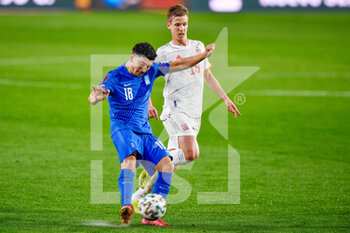 2021-03-25 - Dimitris Limnios of Greece and Dani Olmo of Spain during the 2022 FIFA World Cup, Qualifiers, Group B football match between Spain and Greece on March 25, 2021 at Estadio Municipal Nuevo Los Carmenes in Granada, Spain - Photo Pablo Morano / Orange Pictures / DPPI - 2022 FIFA WORLD CUP, QUALIFIERS, GROUP B - SPAIN AND GREECE - FIFA WORLD CUP - SOCCER