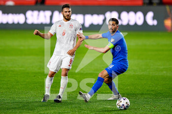 2021-03-25 - Koke of Spain and Tasos Bakasetas of Greece during the 2022 FIFA World Cup, Qualifiers, Group B football match between Spain and Greece on March 25, 2021 at Estadio Municipal Nuevo Los Carmenes in Granada, Spain - Photo Pablo Morano / Orange Pictures / DPPI - 2022 FIFA WORLD CUP, QUALIFIERS, GROUP B - SPAIN AND GREECE - FIFA WORLD CUP - SOCCER
