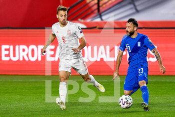 2021-03-25 - Sergio Canales of Spain and Manolis Siopis of Greece during the 2022 FIFA World Cup, Qualifiers, Group B football match between Spain and Greece on March 25, 2021 at Estadio Municipal Nuevo Los Carmenes in Granada, Spain - Photo Pablo Morano / Orange Pictures / DPPI - 2022 FIFA WORLD CUP, QUALIFIERS, GROUP B - SPAIN AND GREECE - FIFA WORLD CUP - SOCCER