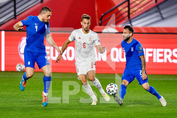 2021-03-25 - Kyriakos Papadopoulos of Greece, Sergio Canales of Spain and Manolis Siopis of Greece during the 2022 FIFA World Cup, Qualifiers, Group B football match between Spain and Greece on March 25, 2021 at Estadio Municipal Nuevo Los Carmenes in Granada, Spain - Photo Pablo Morano / Orange Pictures / DPPI - 2022 FIFA WORLD CUP, QUALIFIERS, GROUP B - SPAIN AND GREECE - FIFA WORLD CUP - SOCCER