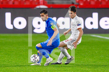2021-03-25 - Tasos Bakasetas of Greece and Eric Garcia of Spain during the 2022 FIFA World Cup, Qualifiers, Group B football match between Spain and Greece on March 25, 2021 at Estadio Municipal Nuevo Los Carmenes in Granada, Spain - Photo Pablo Morano / Orange Pictures / DPPI - 2022 FIFA WORLD CUP, QUALIFIERS, GROUP B - SPAIN AND GREECE - FIFA WORLD CUP - SOCCER
