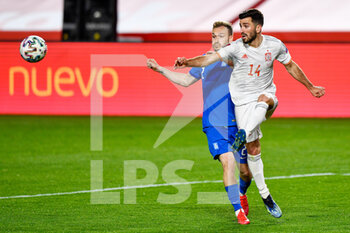 2021-03-25 - Michalis Bakakis of Greece and Jose Gaya of Spain during the 2022 FIFA World Cup, Qualifiers, Group B football match between Spain and Greece on March 25, 2021 at Estadio Municipal Nuevo Los Carmenes in Granada, Spain - Photo Pablo Morano / Orange Pictures / DPPI - 2022 FIFA WORLD CUP, QUALIFIERS, GROUP B - SPAIN AND GREECE - FIFA WORLD CUP - SOCCER