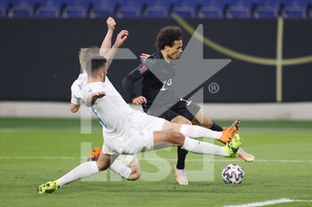 25/03/2021 - Leroy Sane of Germany and Alfons Sampsted, Victor Palsson of Iceland during the 2022 FIFA World Cup, Qualifiers, Group J football match between Germany and Iceland on March 25, 2021 at the Schauinsland-Reisen-Arena in Duisburg, Germany - Photo Jurgen Fromme / firo Sportphoto / DPPI - 2022 FIFA WORLD CUP, QUALIFIERS, GROUP J - GERMANY AND ICELAND - FIFA MONDIALI - CALCIO