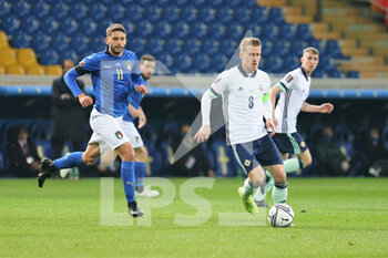2021-03-25 - Steven Davis of Northern Ireland and Domenico Berardi of Italy during the FIFA World Cup 2022, Qualifiers Group C football match between Italy and Northern Ireland on March 25, 2021 at Ennio Tardini stadium in Parma, Italy - Photo Laurent Lairys / DPPI - FIFA WORLD CUP 2022, QUALIFIERS GROUP C - ITALY VS NORTHERN IRELAND - FIFA WORLD CUP - SOCCER