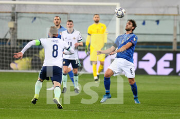 2021-03-25 - Manuele Locatelli of Italy and Steven Davis of Northern Ireland during the FIFA World Cup 2022, Qualifiers Group C football match between Italy and Northern Ireland on March 25, 2021 at Ennio Tardini stadium in Parma, Italy - Photo Laurent Lairys / DPPI - FIFA WORLD CUP 2022, QUALIFIERS GROUP C - ITALY VS NORTHERN IRELAND - FIFA WORLD CUP - SOCCER