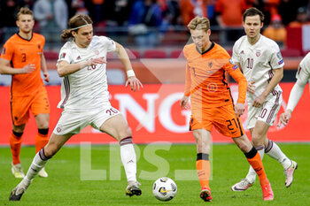 2021-03-27 - Roberts Uldrikis of Latvia, Frenkie de Jong of the Netherlands during the 2022 FIFA World Cup, Qualifiers, Group G football match between Netherlands and Latvia on March 27, 2021 at Johan Cruijff ArenA in Amsterdam, Netherlands - Photo Broer van den Boom / Orange Pictures / DPPI - QUALIFICAZIONI AI MONDIALI FIFA 2022 - GRUPPO G - PAESI BASSI VS LETTONIA - FIFA WORLD CUP - SOCCER