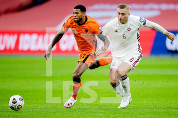2021-03-27 - Georginio Wijnaldum of the Netherlands, Kristers Tobers of Latvia during the 2022 FIFA World Cup, Qualifiers, Group G football match between Netherlands and Latvia on March 27, 2021 at Johan Cruijff ArenA in Amsterdam, Netherlands - Photo Broer van den Boom / Orange Pictures / DPPI - QUALIFICAZIONI AI MONDIALI FIFA 2022 - GRUPPO G - PAESI BASSI VS LETTONIA - FIFA WORLD CUP - SOCCER