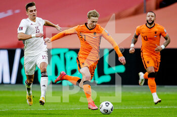 2021-03-27 - Vladislavs Fjodorovs of Latvia, Frenkie de Jong of the Netherlands during the 2022 FIFA World Cup, Qualifiers, Group G football match between Netherlands and Latvia on March 27, 2021 at Johan Cruijff ArenA in Amsterdam, Netherlands - Photo Broer van den Boom / Orange Pictures / DPPI - QUALIFICAZIONI AI MONDIALI FIFA 2022 - GRUPPO G - PAESI BASSI VS LETTONIA - FIFA WORLD CUP - SOCCER