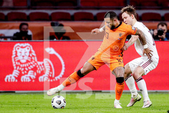 2021-03-27 - Memphis Depay of the Netherlands, Janis Ikaunieks of Latvia during the 2022 FIFA World Cup, Qualifiers, Group G football match between Netherlands and Latvia on March 27, 2021 at Johan Cruijff ArenA in Amsterdam, Netherlands - Photo Broer van den Boom / Orange Pictures / DPPI - QUALIFICAZIONI AI MONDIALI FIFA 2022 - GRUPPO G - PAESI BASSI VS LETTONIA - FIFA WORLD CUP - SOCCER