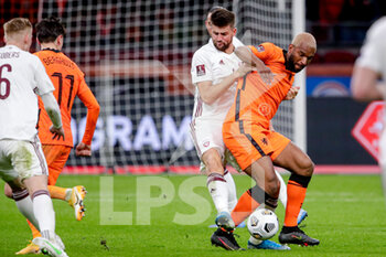 2021-03-27 - Antonijs Cernomordijs of Latvia, Ryan Babel of the Netherlands during the 2022 FIFA World Cup, Qualifiers, Group G football match between Netherlands and Latvia on March 27, 2021 at Johan Cruijff ArenA in Amsterdam, Netherlands - Photo Broer van den Boom / Orange Pictures / DPPI - QUALIFICAZIONI AI MONDIALI FIFA 2022 - GRUPPO G - PAESI BASSI VS LETTONIA - FIFA WORLD CUP - SOCCER
