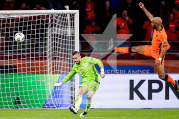 2021-03-27 - Goalkeeper Roberts Ozols of Latvia, Ryan Babel of the Netherlands during the 2022 FIFA World Cup, Qualifiers, Group G football match between Netherlands and Latvia on March 27, 2021 at Johan Cruijff ArenA in Amsterdam, Netherlands - Photo Broer van den Boom / Orange Pictures / DPPI - QUALIFICAZIONI AI MONDIALI FIFA 2022 - GRUPPO G - PAESI BASSI VS LETTONIA - FIFA WORLD CUP - SOCCER