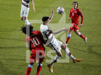 2021-03-30 - Joao Cancelo of Portugal, Gerson Rodrigues of Luxembourg (left) during the 2022 FIFA World Cup, Qualifiers, Group A football match between Luxembourg and Portugal on March 30, 2021 at Josy Barthel in Luxembourg, Luxembourg - Photo Jean Catuffe / DPPI - MONDIALI FIFA 2022, QUALIFICAZIONI, GRUPPO A - LUSSEMBURGO VS PORTOGALLO - FIFA WORLD CUP - SOCCER
