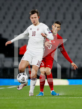 2021-03-30 - Janis Ikaunieks of Latvia and Mert Muldur of Turkey during the 2022 FIFA World Cup, Qualifiers, Group G football match between Turkey and Latvia on March 30, 2021 at Ataturk Olympic Stadium in Istanbul, Turkey - Photo Orange Pictures / DPPI - MONDIALI FIFA 2022, QUALIFICAZIONI, GRUPPO G - TURCHIA VS LETTONIA - FIFA WORLD CUP - SOCCER