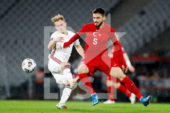 2021-03-30 - Andrejs Ciganiks of Latvia and Okay Yokuslu of Turkey during the 2022 FIFA World Cup, Qualifiers, Group G football match between Turkey and Latvia on March 30, 2021 at Ataturk Olympic Stadium in Istanbul, Turkey - Photo Orange Pictures / DPPI - MONDIALI FIFA 2022, QUALIFICAZIONI, GRUPPO G - TURCHIA VS LETTONIA - FIFA WORLD CUP - SOCCER
