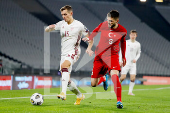 2021-03-30 - Vladislavs Fjodorovs of Latvia and Okay Yokuslu of Turkey during the 2022 FIFA World Cup, Qualifiers, Group G football match between Turkey and Latvia on March 30, 2021 at Ataturk Olympic Stadium in Istanbul, Turkey - Photo Orange Pictures / DPPI - MONDIALI FIFA 2022, QUALIFICAZIONI, GRUPPO G - TURCHIA VS LETTONIA - FIFA WORLD CUP - SOCCER