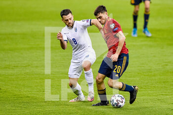 2021-03-31 - Besar Halimi of Kosovo and Pedri of Spain during the 2022 FIFA World Cup, Qualifiers, Group B football match between Spain and Kosovo on March 31, 2021 at Estadio Olimpico in Seville, Spain - Photo Pablo Morano / Orange Pictures / DPPI - MONDIALI FIFA 2022, QUALIFICAZIONI, GRUPPO B - SPAGNA VS KOSOVO - FIFA WORLD CUP - SOCCER
