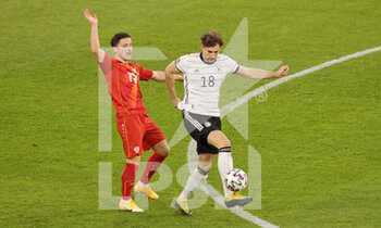 2021-03-31 - Leon Goretzka of Germany and Enis Bardhi of North Macedonia during the 2022 FIFA World Cup, Qualifiers, Group J football match between Germany and North Macedonia on March 31, 2021 at Schauinsland-Reisen-Arena in Duisburg, Germany - Photo Ralf Ibing / firo Sportphoto / DPPI - MONDIALI FIFA 2022, QUALIFICAZIONI, GRUPPO J - GERMANIA VS MACEDONIA DEL NORD - FIFA WORLD CUP - SOCCER