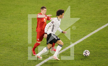 2021-03-31 - Leroy Sane of Germany and Ezgjan Alioski of North Macedonia during the 2022 FIFA World Cup, Qualifiers, Group J football match between Germany and North Macedonia on March 31, 2021 at Schauinsland-Reisen-Arena in Duisburg, Germany - Photo Ralf Ibing / firo Sportphoto / DPPI - MONDIALI FIFA 2022, QUALIFICAZIONI, GRUPPO J - GERMANIA VS MACEDONIA DEL NORD - FIFA WORLD CUP - SOCCER