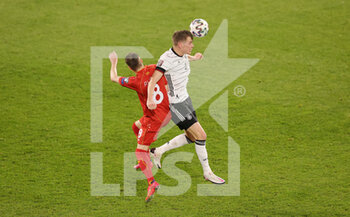 2021-03-31 - Matthias Ginter of Germany and Ezgjan Alioski of North Macedonia during the 2022 FIFA World Cup, Qualifiers, Group J football match between Germany and North Macedonia on March 31, 2021 at Schauinsland-Reisen-Arena in Duisburg, Germany - Photo Ralf Ibing / firo Sportphoto / DPPI - MONDIALI FIFA 2022, QUALIFICAZIONI, GRUPPO J - GERMANIA VS MACEDONIA DEL NORD - FIFA WORLD CUP - SOCCER