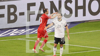2021-03-31 - Emre Can of Germany reacts, Goran Pandev of North Macedonia celebrates his goal 0-1 during the 2022 FIFA World Cup, Qualifiers, Group J football match between Germany and North Macedonia on March 31, 2021 at Schauinsland-Reisen-Arena in Duisburg, Germany - Photo Ralf Ibing / firo Sportphoto / DPPI - MONDIALI FIFA 2022, QUALIFICAZIONI, GRUPPO J - GERMANIA VS MACEDONIA DEL NORD - FIFA WORLD CUP - SOCCER