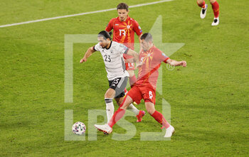 2021-03-31 - Emre Can of Germany and Arijan Ademi of North Macedonia during the 2022 FIFA World Cup, Qualifiers, Group J football match between Germany and North Macedonia on March 31, 2021 at Schauinsland-Reisen-Arena in Duisburg, Germany - Photo Ralf Ibing / firo Sportphoto / DPPI - MONDIALI FIFA 2022, QUALIFICAZIONI, GRUPPO J - GERMANIA VS MACEDONIA DEL NORD - FIFA WORLD CUP - SOCCER