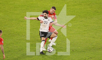 2021-03-31 - Ilkay Gundogan of Germany and Arijan Ademi of North Macedonia during the 2022 FIFA World Cup, Qualifiers, Group J football match between Germany and North Macedonia on March 31, 2021 at Schauinsland-Reisen-Arena in Duisburg, Germany - Photo Ralf Ibing / firo Sportphoto / DPPI - MONDIALI FIFA 2022, QUALIFICAZIONI, GRUPPO J - GERMANIA VS MACEDONIA DEL NORD - FIFA WORLD CUP - SOCCER