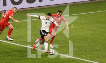 2021-03-31 - Jamal Musiala of Germany and Egzon Bejtulai of North Macedonia during the 2022 FIFA World Cup, Qualifiers, Group J football match between Germany and North Macedonia on March 31, 2021 at Schauinsland-Reisen-Arena in Duisburg, Germany - Photo Ralf Ibing / firo Sportphoto / DPPI - MONDIALI FIFA 2022, QUALIFICAZIONI, GRUPPO J - GERMANIA VS MACEDONIA DEL NORD - FIFA WORLD CUP - SOCCER