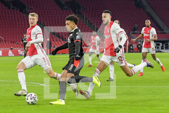2021-01-10 - Perr Schuurs of Ajax, Donyell Malen of PSV, Noussair Mazraoui of Ajax during the Netherlands championship Eredivisie football match between Ajax and PSV on January 10, 2021 at Johan Cruijff Arena in Amsterdam, Netherlands - Photo Gerrit van Keulen / Orange Pictures / DPPI - AJAX VS PSV - NETHERLANDS EREDIVISIE - SOCCER
