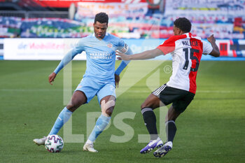 2021-01-31 - Denzel Dumfries of PSV, Tyrell Malacia of Feyenoord during the Netherlands championship Eredivisie football match between Feyenoord and PSV on January 31, 2021 at De Kuip in Rotterdam, Netherlands - Photo Marcel ter Bals / Orange Pictures / DPPI - FEYENOORD AND PSV - NETHERLANDS EREDIVISIE - SOCCER
