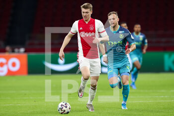 2021-02-21 - Perr Schuurs of Ajax, Lennart Thy of Sparta Rotterdam during the Netherlands championship Eredivisie football match between Ajax and Sparta Rotterdam on February 21, 2021 at Johan Cruijff ArenA in Amsterdam, Netherlands - Photo Ben Gal / Orange Pictures / DPPI - AJAX AND SPARTA ROTTERDAM - NETHERLANDS EREDIVISIE - SOCCER