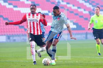 2021-02-28 - Pablo Rosario of PSV and Ryan Gravenberch of Ajax during the Netherlands championship Eredivisie football match between PSV and Ajax on February 28, 2021 at Philips Stadion in Eindhoven, Netherlands - Photo Perry vd Leuvert / Orange Pictures / DPPI - PSV AND AJAX - NETHERLANDS EREDIVISIE - SOCCER